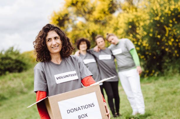 istock volunteer holding the donation box 1266072822