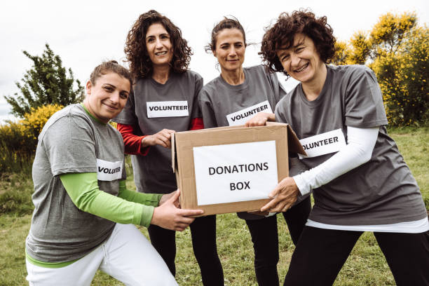 istock volunteer holding the donation box 1266073371