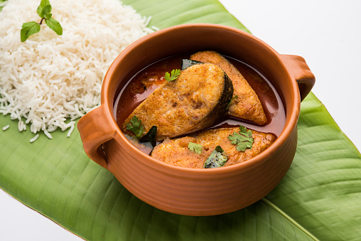 Spicy Fish Curry - kerala, konkan, bengal, goa style in Red and brown colour, served with rice