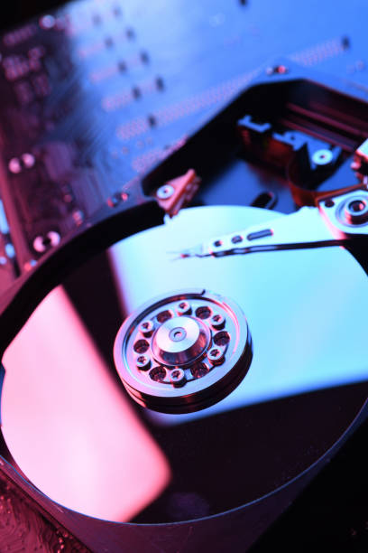 istock Computer Hard disk drives HDD , SSD on circuit board ,motherboard background. Close-up. With red-blue lighting 1266085850