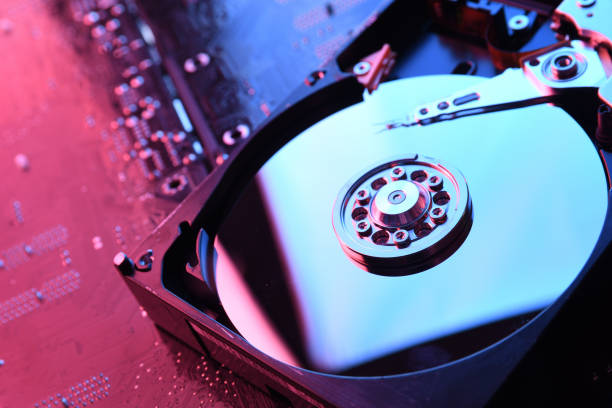 istock Computer Hard disk drives HDD , SSD on circuit board ,motherboard background. Close-up. With red-blue lighting 1266086235