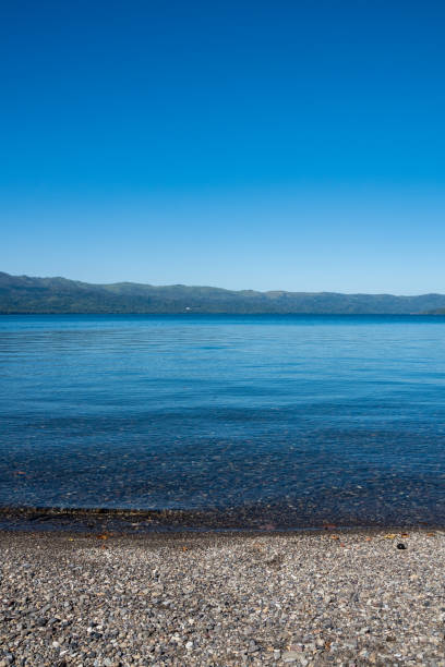 istock Crystal clear water of a blue calm lake 1266086604