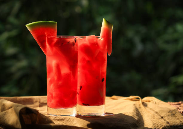 istock Fresh watermelon in the glass with greenish background 1266087492