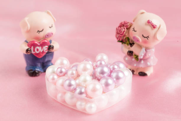 istock Piggy doll and Pearl 1266087696