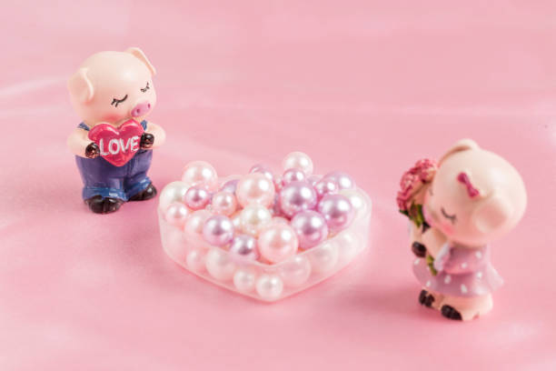 istock Piggy doll and Pearl 1266087699