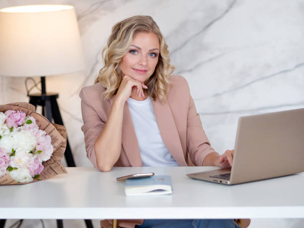 istock Stylish and confident young Director, sitting at a Desk 1266089273