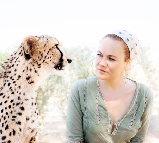 istock Woman and cheetah 1266092912
