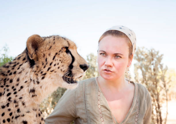 istock Woman and cheetah 1266092916