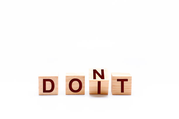 istock Spinning cubes and changing the word DONT to DOIT 1266094236