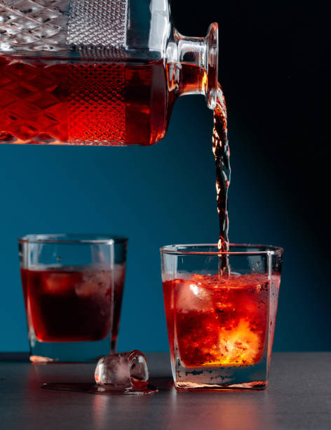 istock Whiskey pours into a steamed glass with natural ice. 1266095092