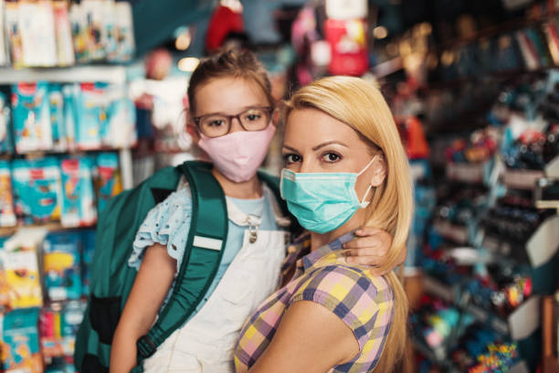 istock Mother and daughter in a bookstore 1266096972