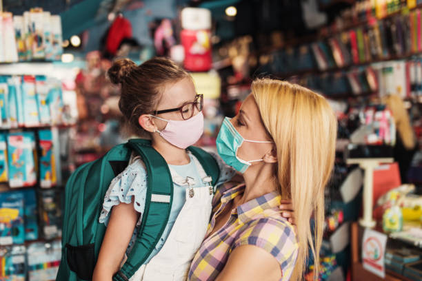 istock Mother and daughter in a bookstore 1266097095