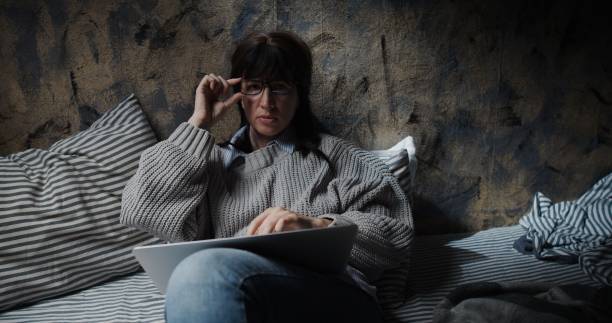 istock Woman is being disturbed during her work on laptop at home 1266097439