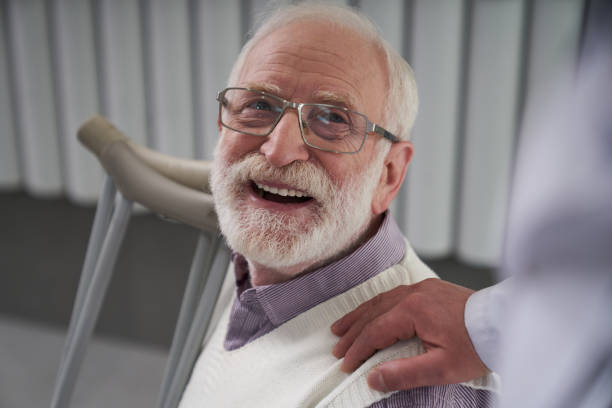 istock Elderly patient looking thankful for his doctors care 1266097947
