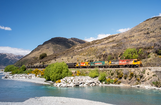 Arthur's Pass, New Zealand - November 7, 2012: One of New Zealand's freight  trains travelling through the Southern Alps on its way towards the West Coast of  the South Island.