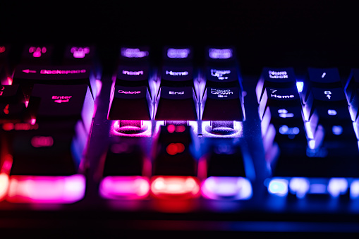 Modern computer keyboard for gamers with neon light. Colorful concept.