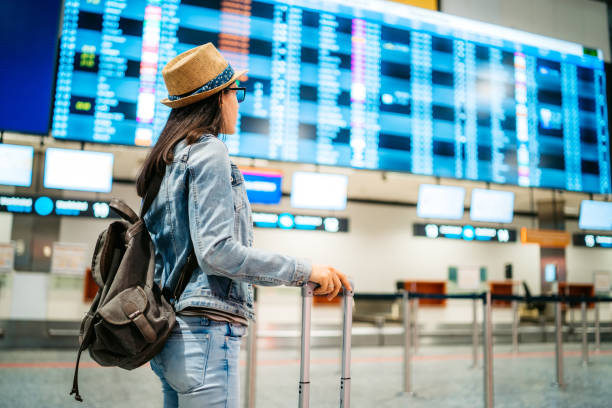 istock Tourist checking the arrival departure board 1266104530