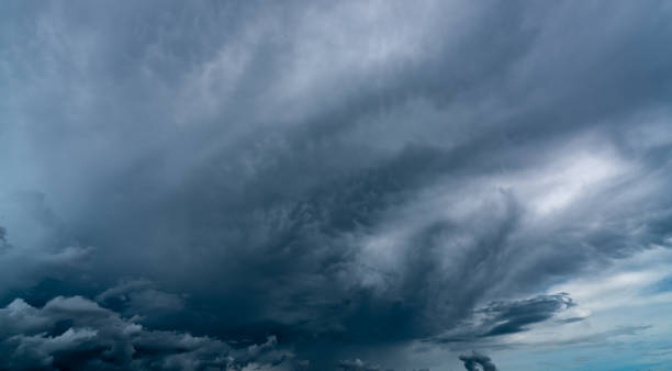 istock Dark dramatic sky and clouds. Background for death and sad concept. Gray sky and fluffy white clouds. Thunder and storm sky. Sad and moody sky. Nature background. Dead abstract background. Cloudscape. 1266105429