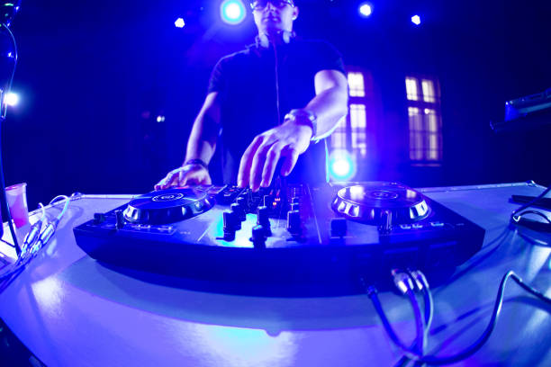 istock DJ playing and mixing music at party 1266107790