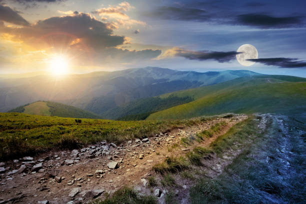 istock time change above the mountain road through meadow 1266107889