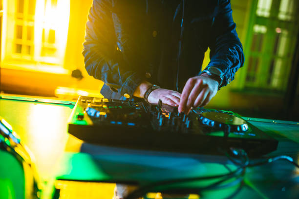 istock DJ playing and mixing music at party 1266108157