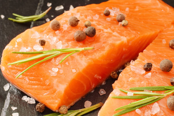 istock Red raw uncooked salmon with rosemary 1266108169