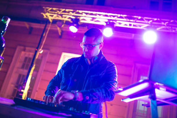 istock DJ playing and mixing music at party 1266108216
