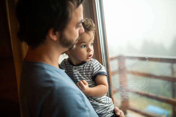 istock Cute toddler in father's arms 1266113978