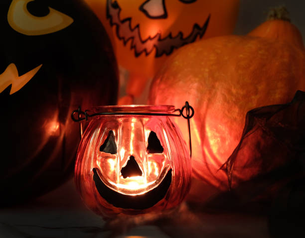 istock Burning candles in the darkness with shadow, halloween background 1266114273