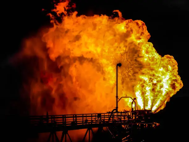 Photo of An oil semi submersible rig flaring gas to check the oil well.