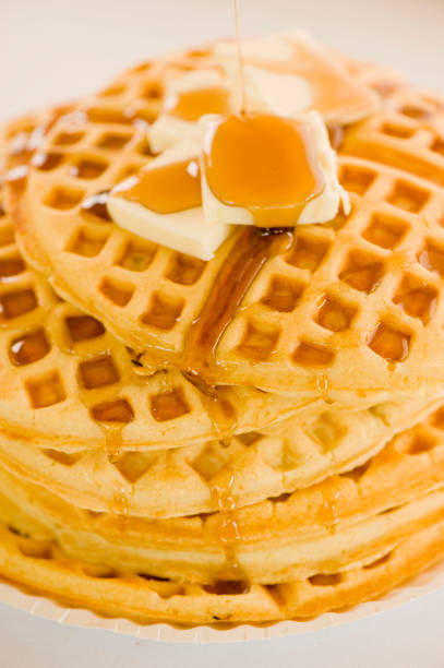 istock Waffles. Homemade Waffles  w/ crispy maple Bacon, butter & maple syrup. Classic American breakfast or brunch favorite. Made from scratch Waffles w/ bacon, butter & maple syrup. 1266114904