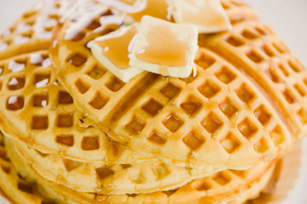istock Waffles. Homemade Waffles  w/ crispy maple Bacon, butter & maple syrup. Classic American breakfast or brunch favorite. Made from scratch Waffles w/ bacon, butter & maple syrup. 1266114910