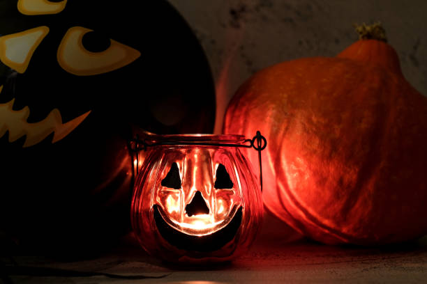 istock Burning candles, pumkin, balloon in home interior for halloween 1266120331