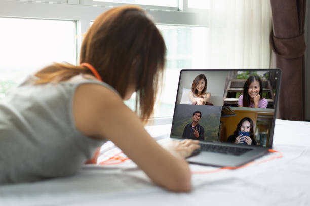 istock Woman Participating in Video Call with Friends 1266123280