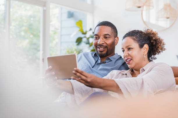 istock Husband and wife take selfie with digital tablet 1266123469