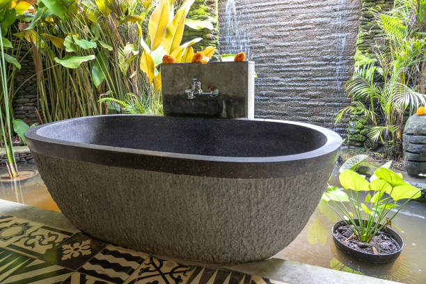 istock Romantic outdoor stone bathroom in island Bali, Indonesia 1266123724