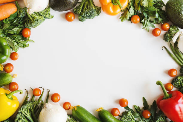 istock Assorted vegetables and fresh herbs on white background, top view. Plant based diet. Seasonal vegetables 1266126394