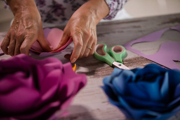 istock Mid-adult woman exploring new hobby during lockdown 1266126446