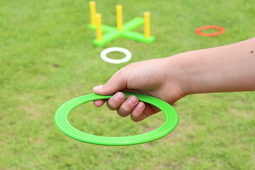 children's play ring toss on green grass