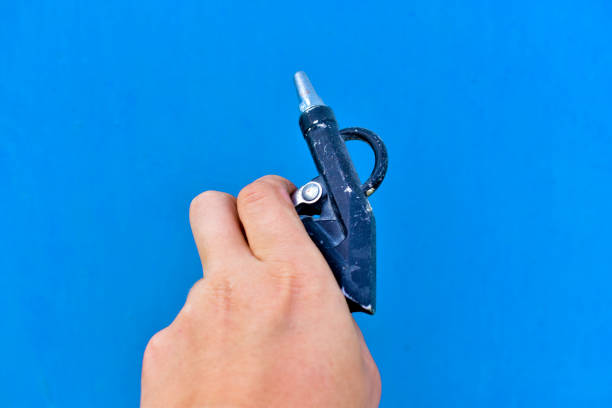 istock Gun for painting surfaces spray gun on a blue background 1266133649
