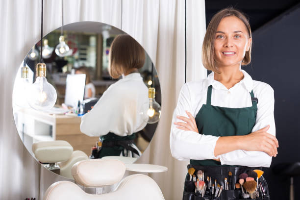 istock woman visagiste standing with brushes 1266134792