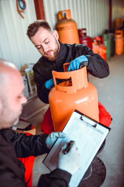 istock Workers Writing Down New Gas Cylinder Arrival Date 1266137763