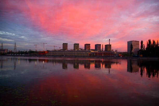 istock New homes are reflected in the river at dawn. 1266139823