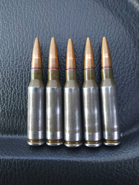 istock Cartridges from a Kalashnikov assault rifle close-up. 1266139984