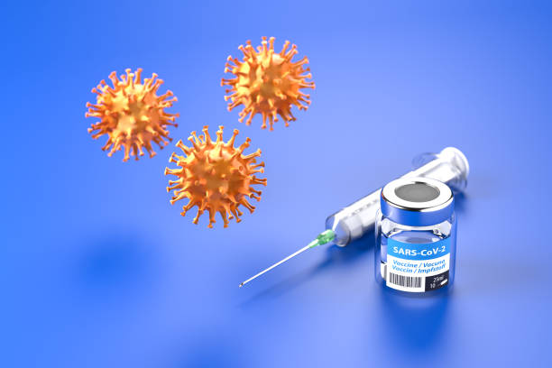 istock Vaccination against Corona Virus SARS-CoV-2: glass container with vaccination, a syringe behind, three corona viruses above. The word vaccination in English, Spanish, French and German on the label. 1266142667
