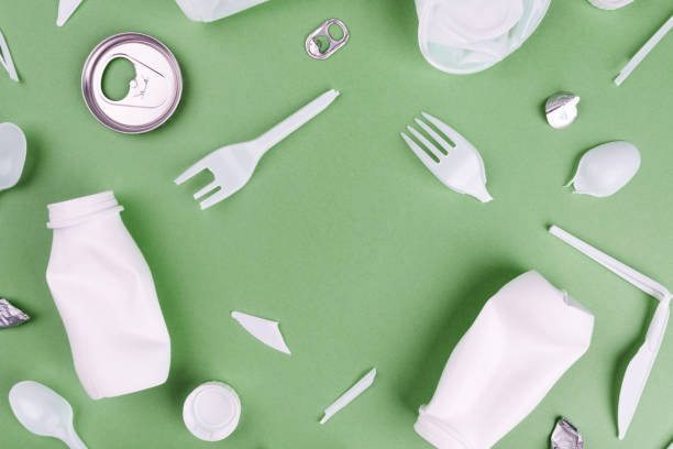 istock Eco plastic recycling concept. Single use plastics on green background. 1266142958