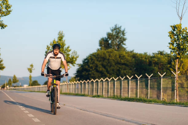 istock Cyclist riding a bike 1266143116