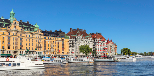 Buildings along Strandvägen and tourboats at Nybroviken in central Stockholm.
