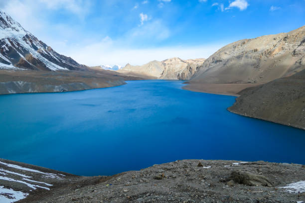 istock Tilicho Lake - A panoramic view on turquoise colored lake in Himalayas 1266144373