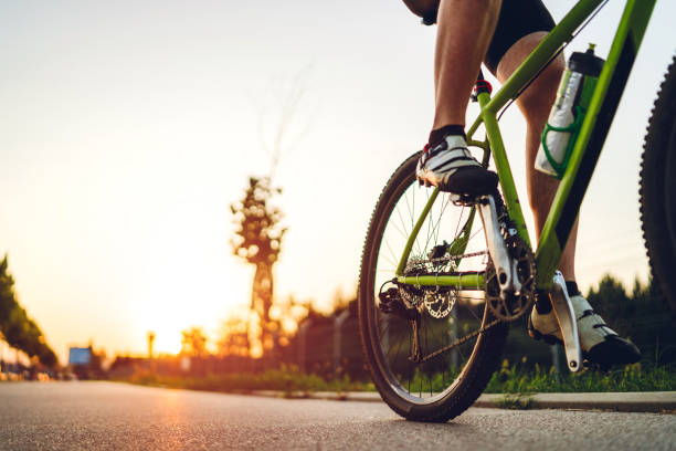 istock Cyclist foot on bicycle pedal 1266144516